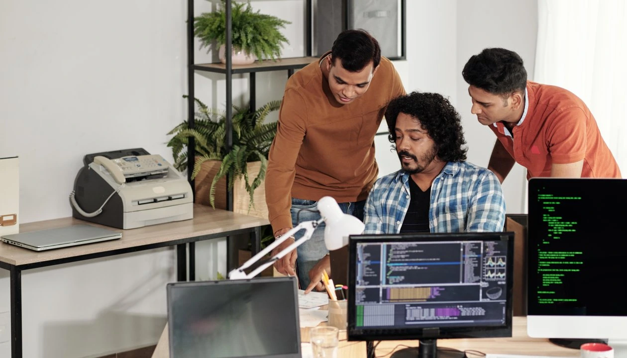 Group of developers working in one sync